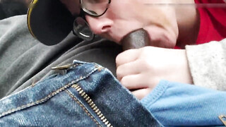 Female employee giving a fast suck in car to a black client